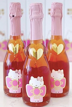 Load the image into the Gallery viewer, Hello Kitty Sweet Pink Sparkling Rosé teddy bear holding a heart with &quot;I love you&quot;
